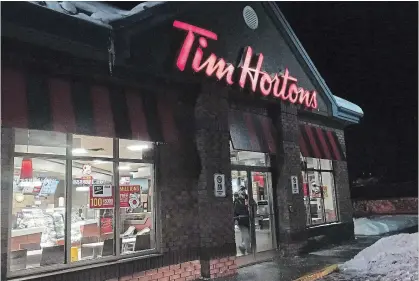  ?? DOUG IVES THE CANADIAN PRESS ?? Bad publicity for Tim Hortons regarding withholdin­g wages, among other issues, have hurt the company’s reputation, a survey suggests.