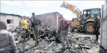  ??  ?? Damage caused by the fire in Vygieskraa­l informal settlement has not deterred the kids from running.