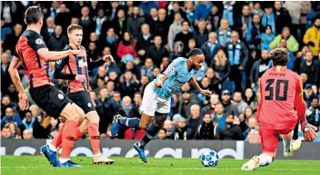  ??  ?? Fall guy: Raheem Sterling trips himself up (above), goes to ground (top) and earns a bizarre penalty; (right) the forward scores later with a fine strike