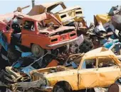  ?? GETTY IMAGES ?? All vehicles contain valuable parts that are stripped before heading to the crusher.