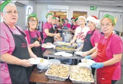  ??  ?? Members of the Reserve Mines Seniors and Pensioners Club, from left, Diane Steiger, Jeanette Grant, Debby Parsons, Maureen McLean, Carmella MacLeod, Sharon MacLeod, Donna Mullins, Margie Penney, Cheryl MacKenzie and volunteers, Paulette Murphy, Virgina MacKeigan, Dolores Doucette and Colleen McLean, scoop up Christmas dinner.