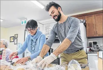  ?? CARLA ALLEN ?? Shirley Deveau and Andre Michel preparing lunch at the HOPE Centre last winter as part of Yarmouth’s inaugural 100 Meals initiative. The project is being undertaken a second time, starting Dec. 3, and the HOPE Centre is the kickoff location.