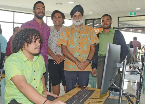  ?? Photo: ?? University of the South Pacific Vice-Chancellor and president Professor Pal Ahluwalia (standing third from left) with students during the opening of the University of the South Pacific Outreach Commons at Hexagon Building in Davuilevu, Nausori on August 5, 2020.
