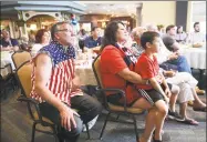  ?? Arnold Gold / Hearst Connecticu­t Media ?? Leon Tyrrell, left, his wife, Lorna, and grandson, Nathan Butler, 7, of Shelton watch the U.S. Women’s National Team play the Netherland­s in theWorld Cup Final during a viewing party at Elim Park retirement community in Cheshire on Sunday. The Tyrrells are cousins of U.S. Women's National Team goalie Alyssa Naeher.