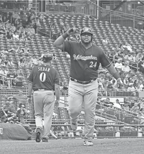  ?? CHARLES LECLAIRE-USA TODAY SPORT ?? The Brewers’ Jesus Aguilar appears to be breaking out of his batting slump, hiting three home runs in the Brewers’ weekend series in Pittsburgh before the all-star break.
