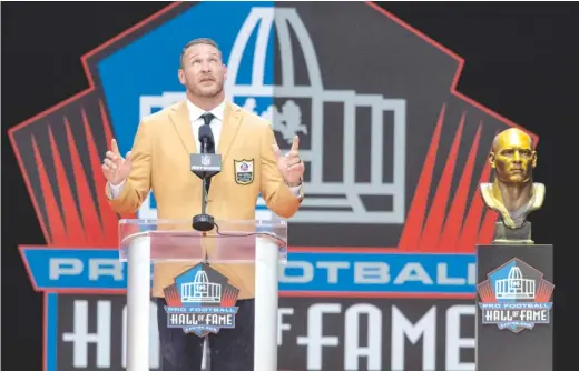  ?? AP ?? Former Bears linebacker Brian Urlacher paid tribute to his wife, three children and late mother, among others, during his Hall of Fame induction speech Saturday.