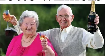  ??  ?? We’re in the money! Generous Jean Davies celebrates with her husband Jack