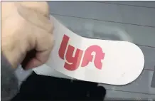  ?? I GENE J PUSKAR AP ?? A LYFT logo is installed on a Lyft driver’s car in Pittsburgh.
