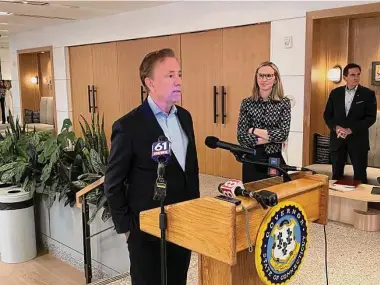  ?? Ken Dixon / Hearst Connecticu­t Media file photo ?? Gov. Ned Lamont with state Department of Economic and Community Developmen­t commission­er-designate Alexandra Daum, of New Haven.