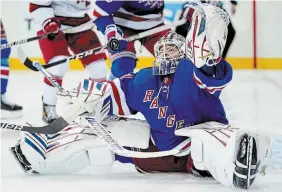  ?? JOHN MINCHILLO THE ASSOCIATED PRESS FILE PHOTO ?? New York Rangers goaltender Igor Shesterkin makes a save in Game 4 of their second-round playoff series against the Carolina Hurricanes.