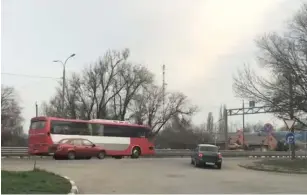  ?? (Reuters) ?? A STILL IMAGE from video footage taken on April 17 shows a bus carrying Russian military contractor­s near Rostov-on-Don on its way to a base in Molkino, Russia.