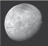  ?? NASA/JHUAPL/SWRI VIA AP ?? Pluto’s large moon, Charon, as seen by NASA’s New Horizons spacecraft just before closest approach on July 14.