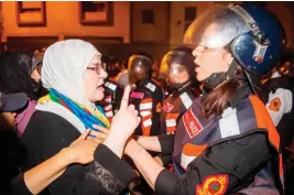  ??  ?? Police face protesters during a demonstrat­ion against corruption, repression and unemployme­nt in Al-Hoceima, Morocco, on Saturday. (AFP)