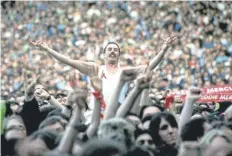  ?? PICTURE: GETTY ?? More than 70,000 people packed Wembley for a concert in memory of Queen’s Freddie Mercury - including this lookalike