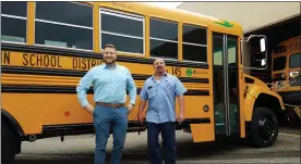  ?? DAN SOKIL — MEDIANEWS GROUP ?? North Penn School District Coordinato­r of Transporta­tion Nick Kraynak, left, and Technician Specialist Angelo Tornetta stand in front of a newly delivered propane school bus on May 17, 2019.