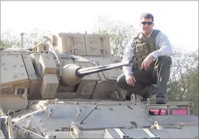  ?? Hearst Connecticu­t Media file photo ?? Navy SEAL Brian Bill on a Bradley fighting vehicle in 2004.