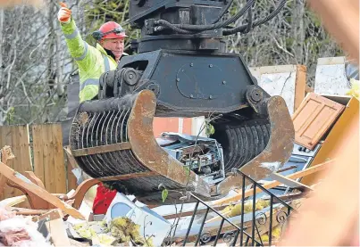  ?? Picture: Mike Day. ?? The boiler is removed from the Cunningham­s’ home in Callander.