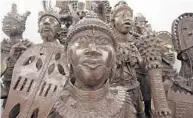  ?? COURTESY OF BRONZE KINGDOM ?? Statues from the Yoruba tribe of Benin and Nigeria are on display at Bronze Kingdom, an African art gallery in south Orlando.