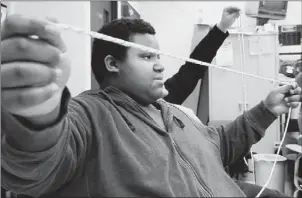  ?? Connor Mulvaney/Post-Gazette ?? Kenny Branch, 17, of Natrona Heights tightens a knot during the Highlands Emergency Services Alliance emergency response class at Highlands High School.