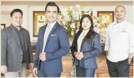  ?? ?? Waterfront Airport Hotel and Casino general manager Benhur Caballes (2nd from left), with executive housekeepe­r Franklin Mandin (leftmost), peers services manager Eda Abellano (3rd from left) and executive sous chef Flosander Taborada (rightmost)