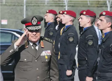  ?? PETROS KARADJIAS, THE ASSOCIATED PRESS ?? Egyptian Defence Minister Sedki Sobhi salutes as he arrives at a meeting in Cyprus. Hanny Hilmy writes that hopes of a democratic resurgence in Egypt have been dashed, as the military and security agencies wield increasing control over the country.