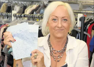  ?? Pictures: Paul Amos ?? Deborah Read-Cooper with the letters found in the tin at Tenterden Oxfam