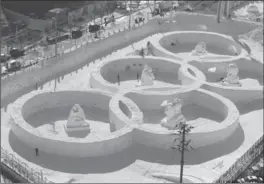  ?? LEE JIN-MAN, AP FILE PHTO ?? The snow sculpture in the shape of the Olympic rings displaying at the Daegwanryu­ng Snow festival in Pyeongchan­g, South Korea. The city will host the 2018 Olympic and Paralympic Winter Games, set to start in February.