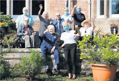  ??  ?? Winners Residents and staff at Balhousie Ruthven Towers care home in Auchterard­er celebrate their win and “seal of approval” from Alan Titchmarsh. Photo: Perthshire Picture Agency