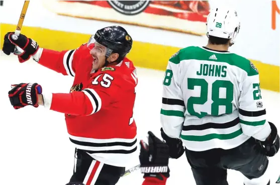  ??  ?? Blackhawks forward Artem Anisimov celebrates his goal in front of Stars defenseman Stephen Johns in the second period Thursday at the United Center. | JIM YOUNG/ AP