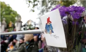  ?? Photograph: Peter Cziborra/Reuters ?? A Paddington Bear card is seen on The Mall on the day of Queen Elizabeth’s funeral.