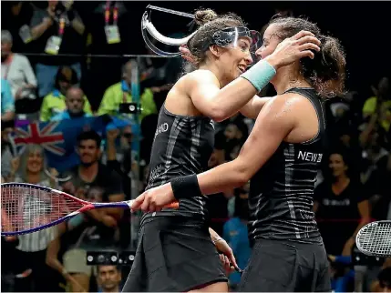  ?? GETTY IMAGES ?? Joelle King, left, and Amanda Landers-murphy celebrate after winning gold in the women’s squash doubles.