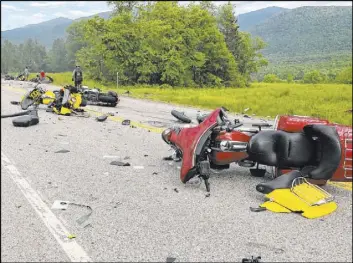  ?? The Associated Press ?? This photo provided by Miranda Thompson shows the scene where 10 motorcycle­s and a pickup truck collided on a highway Friday in Randolph, N.H.