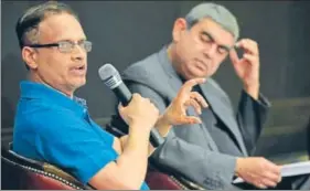  ?? AFP ?? Infosys’ chief operating officer UB Pravin Rao (left) with CEO Vishal Sikka during the company’s fourthquar­ter results announceme­nt, in Bengaluru on Thursday