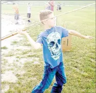 ?? PHOTO SUBMITTED ?? Smooth Delivery – Using an atlatl, Lewis Standingbe­ar, 9, quickly had spears and darts flying thorugh the air at the Young Outdoorsme­n United Primitive Hunting Tool Seminar for youth in Anderson.