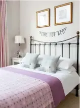  ??  ?? WARM WELCOME The guest room shares the master bedroom’s nude-coloured walls, cosy fabrics and black touches, while hints of pink and lilac give it a tranquil atmosphere. The throw and cushions are from Bronte by Moon.