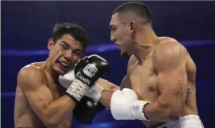  ?? ?? Teófimo López lands a right to Pedro Campa their junior welterweig­ht bout on Saturday in Las Vegas. Photograph: John Locher/AP