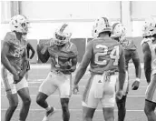  ?? COURTESY OF MIAMI ATHLETICS ?? Hurricanes football players escape South Florida’s heat and humidity inside UM’s new indoor practice facility.