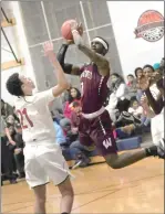  ?? Photo by Ernest A. Brown ?? Woonsocket senior Denzel Lyles, right, glides past a Mt. Pleasant defender during the Villa Novans Division I road victory Thursday night.