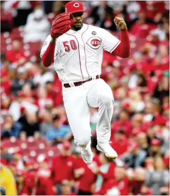  ?? DAVID JABLONSKI / STAFF ?? Reds reliever Amir Garrett eight-game suspension is over and he was being welcomed back to the bullpen by his teammates before Tuesday’s game against the San Diego Padres. The Reds did not have a lefthander in the bullpen during Garrett’s forced absence