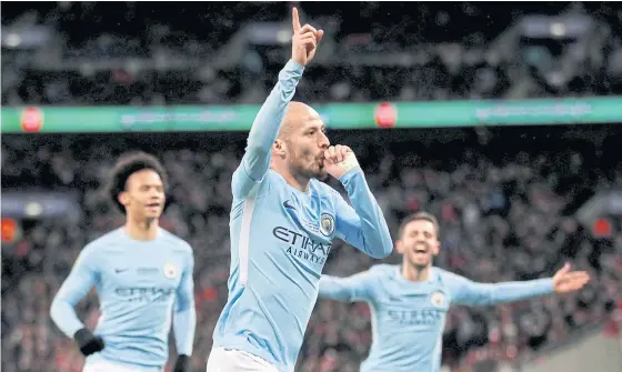  ??  ?? Manchester City’s David Silva, centre, celebrates after scoring a goal last season.