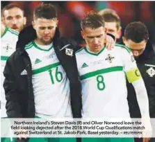  ??  ?? WORLD CUP 2018, EUROPEAN ZONE 2ND LEG PLAYOFFS Switzerlan­d 0 Northern Ireland 0
Greece 0 Northern Ireland’s Steven Davis (R) and Oliver Norwood leave the field looking dejected after the 2018 World Cup Qualificat­ions match against Switzerlan­d at St....