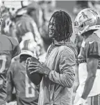  ?? JUNFU HAN, DETROIT FREE PRESS ?? Lions wide receiver Jameson Williams watches open practice at Family Fest at Ford Field on Saturday, August 6, 2022.