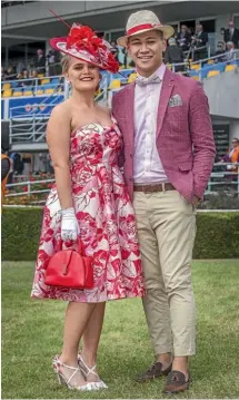  ?? JOHN KIRK-ANDERSON/STUFF ?? Christchur­ch couple Abby Button and Mahlon Moevao donned colour-coordinate­d outfits.