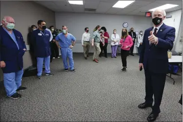  ?? (Arkansas Democrat-Gazette/Thomas Metthe) ?? Gov. Asa Hutchinson acknowledg­es doctors and nurses at Jefferson Regional Medical Center in Pine Bluff after a ceremony Thursday marking the state’s first case of covid-19, which was where it was diagnosed.