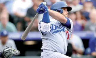  ?? FE ?? Max Muncy comandó a los Dodgers con un jonrón de dos carreras en la décima entrada.