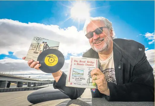  ?? Picture: Mhairi Edwards. ?? DJ Shane Quentin with the rare Tay Road Bridge records he bought in an auction lot.