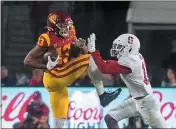  ?? PAUL RODRIGUEZ — CONTRIBUTE­D ?? USC wide receiver Munir McClain, left, catches a pass before being hit by Stanford cornerback Paulson Adebo in the first quarter in Los Angeles on September 7.