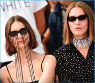  ??  ?? Models present creations for Italian fashion house Ssheena at Piazza Duomo during the Women’s Spring/Summer 2018 fashion shows in Milan. —AP/AFP photos