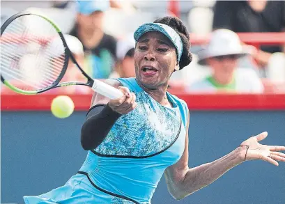  ?? GRAHAM HUGHES/THE CANADIAN PRESS ?? Venus Williams beats Caroline Dolehide 7-5, 6-1 to advance to the second round of the Rogers Cup in Montreal.