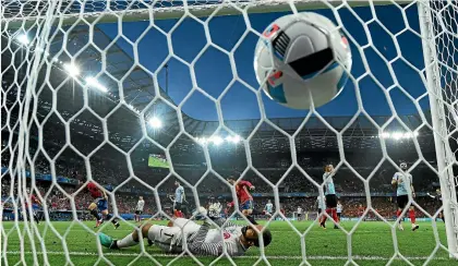  ?? GETTY IMAGES ?? Spain’s Nolito beats Turkey goalkeeper Volkan Babacan to score their second goal in their 3-0 win.